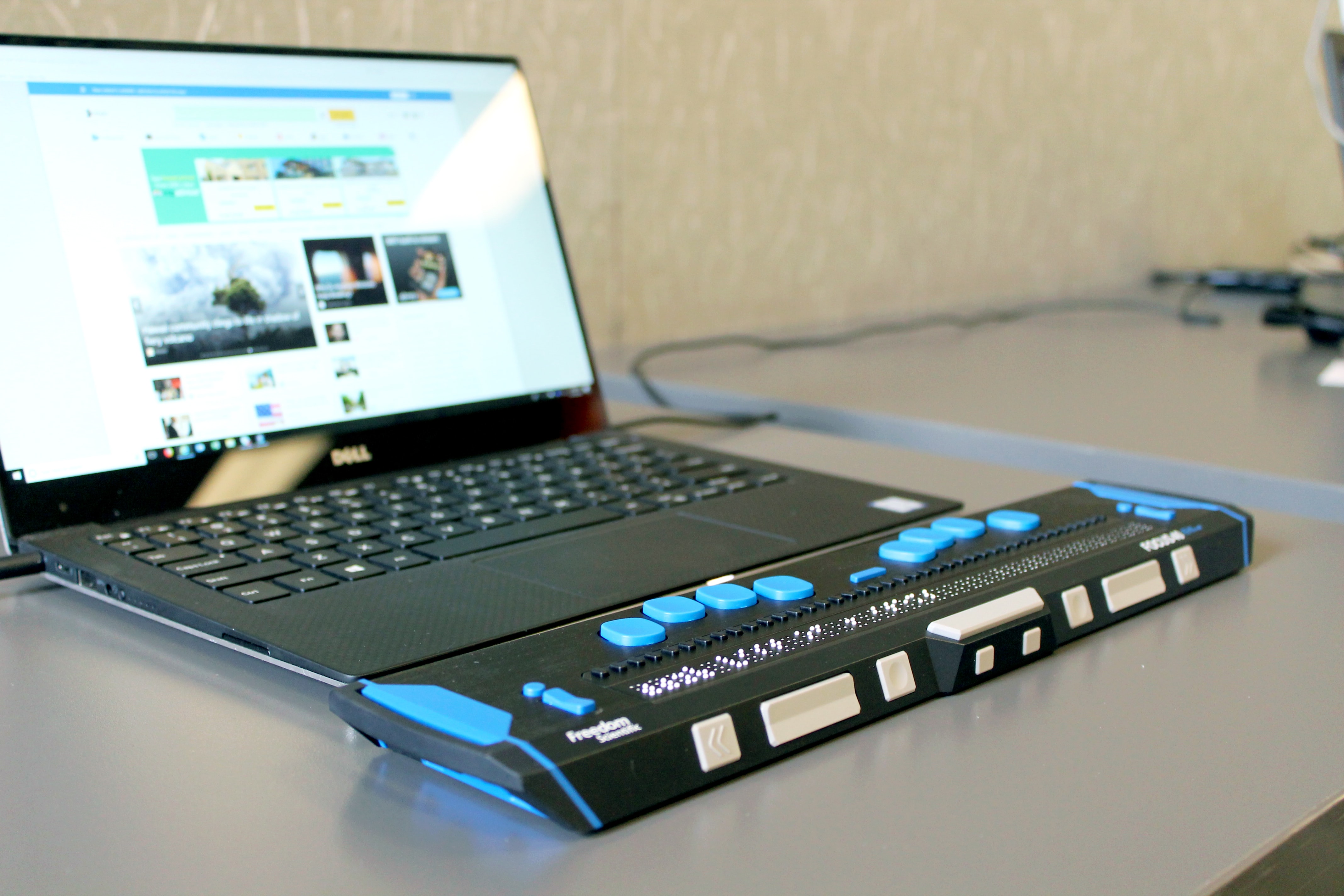 Image of a laptop with a screen reader